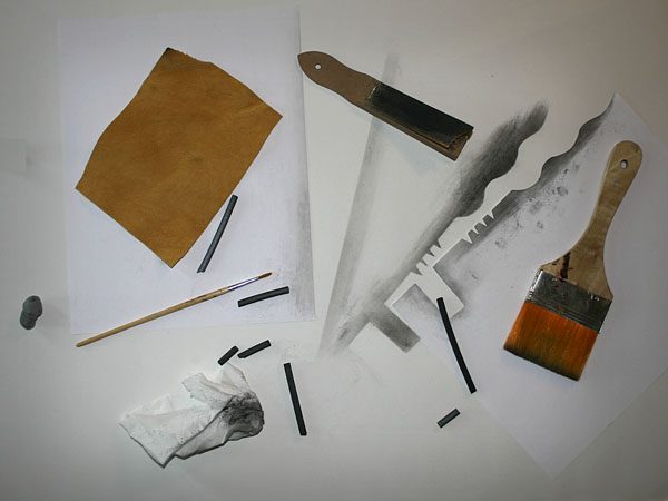 photo of charcoal, art blending tools on a table top