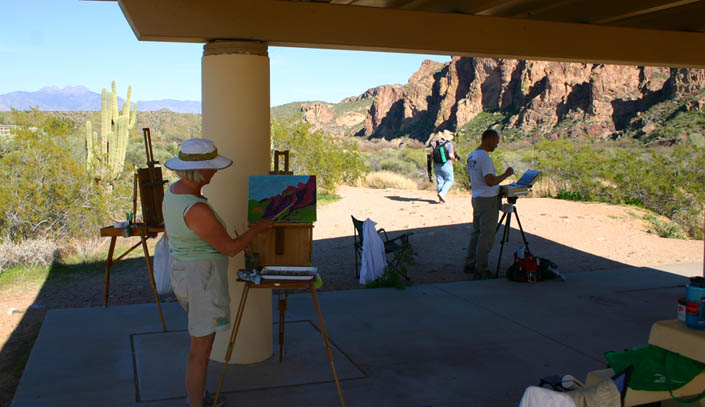 art students pictured painting out in the mesa arizona desert.