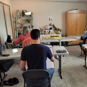 photo of students in classroom drawing.